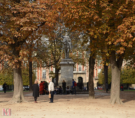 Statue of Louis XIII in Place des Vosges garden
